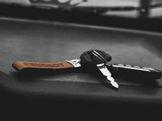 keys sitting on a black dash of a car
